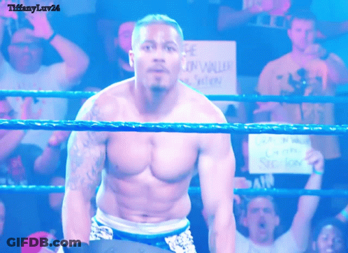 Shirtless Wrestler In Ring With Gun Violence Sign GIF