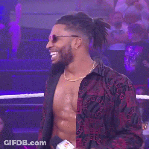 Shirtless Wrestler In Sunglasses And Necklace In Ring GIF