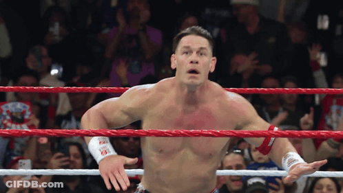 Shirtless Wrestler In Wrestling Ring With Crowd GIF
