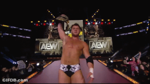 Shirtless Wrestler Interviewed With AEW Microphone GIF