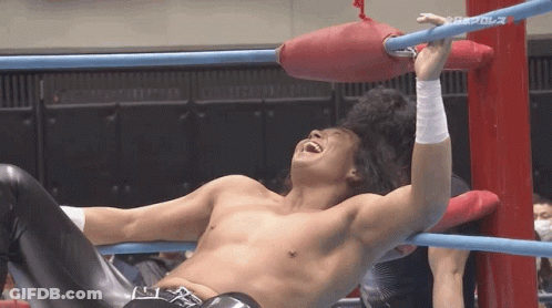 Shirtless Wrestler Laughing In Ring With Black Belt R GIF