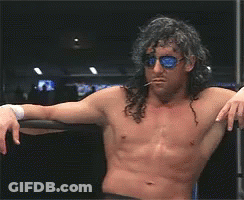 Shirtless Wrestler Long Hair Sunglasses Leaning On Railing GIF