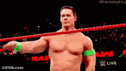 Shirtless Wrestler Saluting In Wrestling Ring GIF