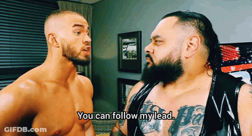Shirtless Wrestler Saying You Can Follow My Lead To Another Wrestler GIF