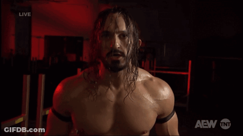 Shirtless Wrestler Says You're Crap In Front Of TNT Logo GIF