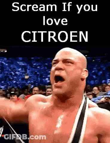 Shirtless Wrestler Screaming In Front Of Crowd Saying Scream If You Love Citroen GIF