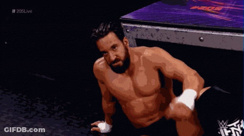 Shirtless Wrestler Sitting On Floor GIF