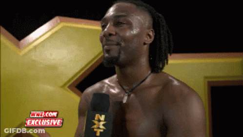 Shirtless Wrestler Talking Into Microphone GIF