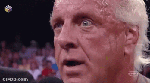Shirtless Wrestler Talking Into Microphone GIF