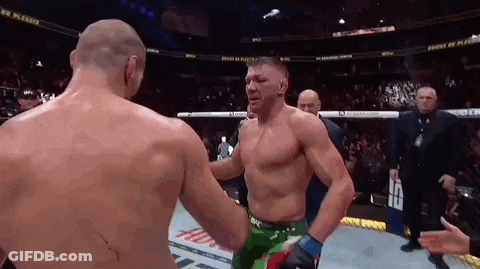 Shirtless Wrestler Talking Into Microphone GIF
