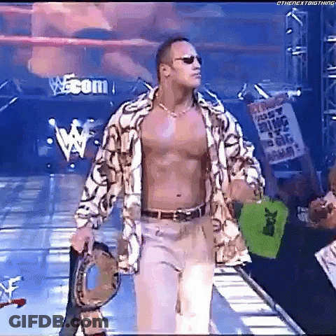 Shirtless Wrestler Walking Down Ramp Holding Drum GIF