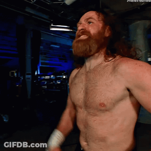 Shirtless Wrestler With Beard In Dark Room GIF