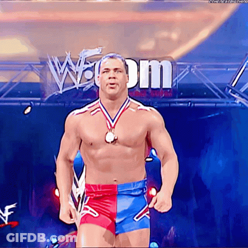 Shirtless Wrestler With Medal And W Dm Sign GIF