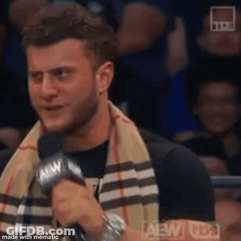 Shirtless Wrestler With Scarf Tickets On Sale Sign GIF