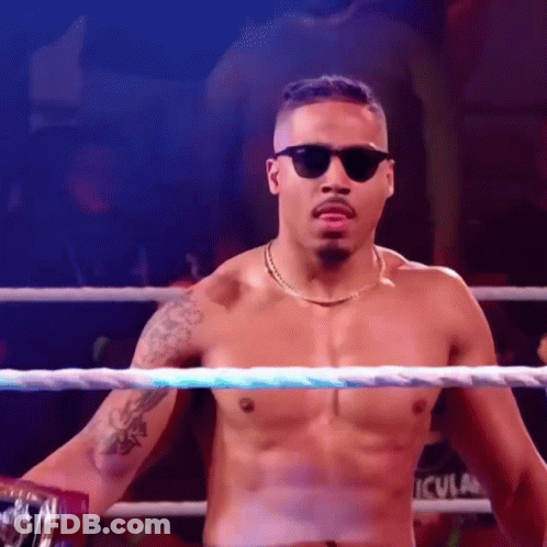Shirtless Wrestler With Sunglasses And Chain In Ring GIF