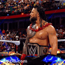 Shirtless Wrestler With W Belt In Ring GIF