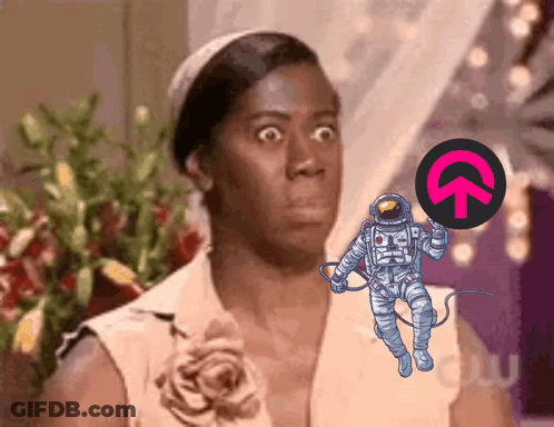 Shocked Woman Looking At Astronaut Holding Circle With Upward Arrow GIF