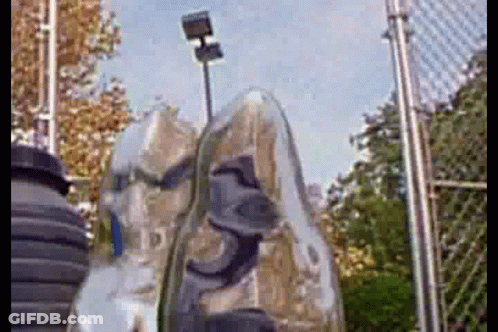 Shoes Hanging On Chain Link Fence Tennis Court GIF