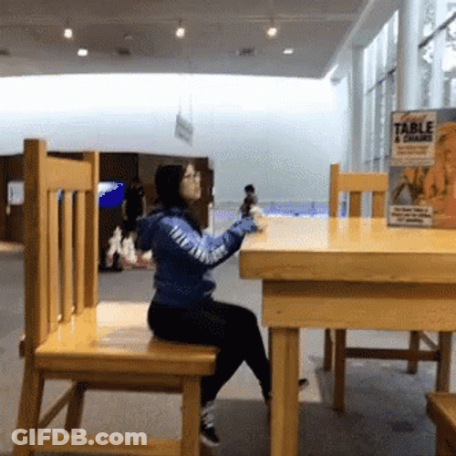 Short Girl Seating In A Huge Chair GIF