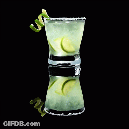 Shot Glass With Ice And Limes GIF