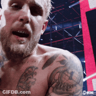 Showtime Text On Man's Shoulder GIF