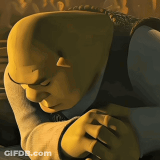 Shrek From Shrek Is Laying Down With His Head On His Hands GIF