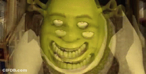 Shrek From Shrek Is Smiling And Looking At The Camera While Holding A Piece Of Toilet Paper . GIF