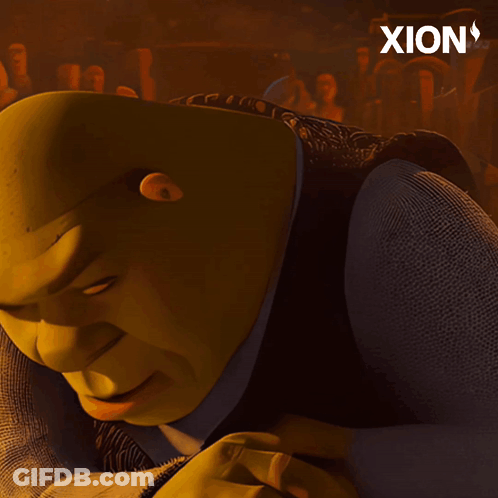 Shrek From The Movie Shrek Is Laying Down And Looking At The Camera GIF