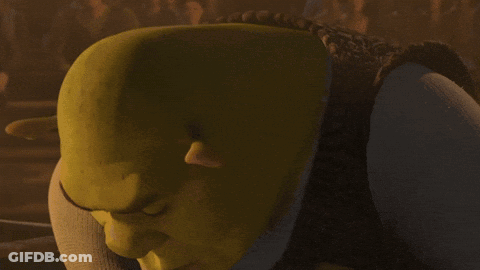 Shrek From The Movie Shrek Is Looking At The Camera With A Serious Look On His Face GIF