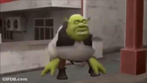 Shrek From The Movie Shrek Is Standing On His Hind Legs On The Sidewalk . GIF