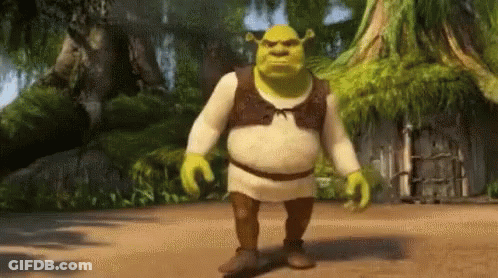 Shrek From The Movie Shrek Is Walking On A Dirt Path GIF