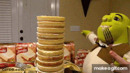 Shrek Holding Fork Next To Samoas Cookies GIF