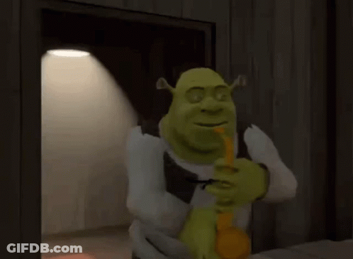 Shrek Is Holding A Pencil In His Mouth And Smiling While Standing In Front Of A Door . GIF