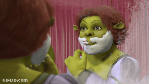 Shrek Shaving In Front Of Pink Curtain GIF