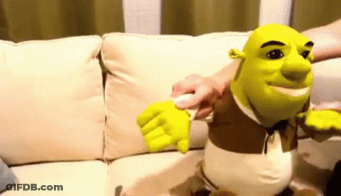 Shrek Stuffed Animal On Couch Being Touched GIF