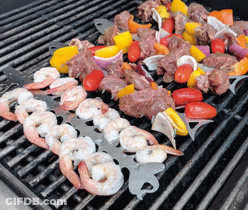 Shrimp And Meat Cooking On Grill With Vegetables GIF