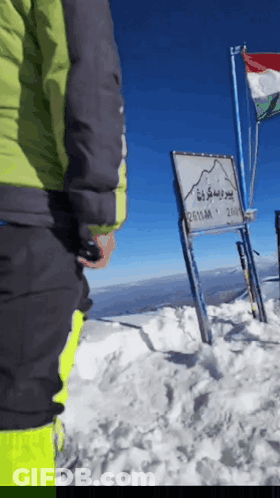 Sign On Snow Covered Mountain Says 2611M GIF
