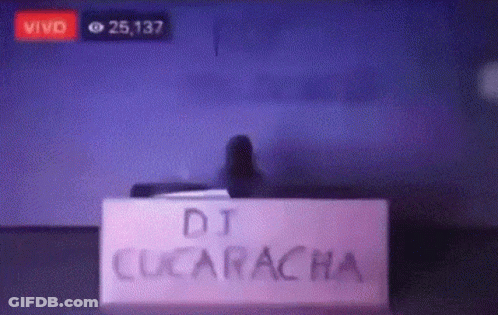 Sign Saying DJ Cucaracha In Front Of Screen GIF