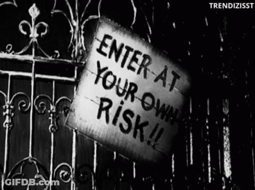 Sign Saying Enter At Your Own Risk GIF