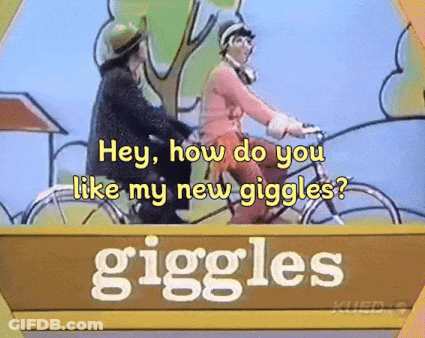 Sign Saying Giggles With Two People Riding Bicycles GIF