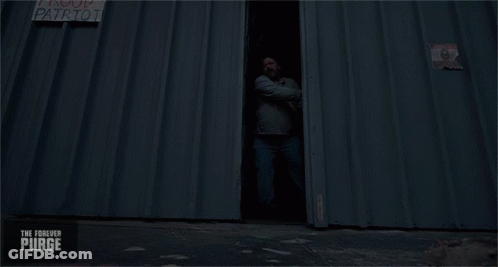 Sign Saying Purging Is American On Building GIF