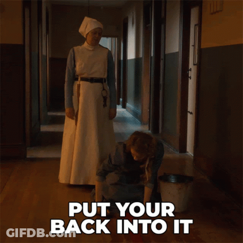 Sign Saying Put Your Back Into It Beside Woman GIF