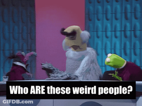 Sign Saying Who Are These Weird People Next To Stuffed Animals GIF