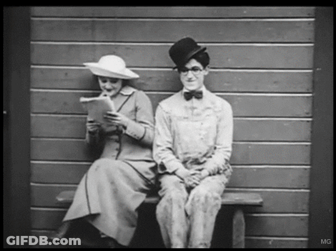Silent Film Couple Harold Lloyd Sitting GIF