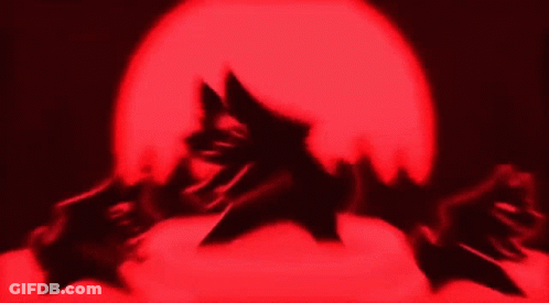 Silhouette Covering Face In Front Of Red Light GIF