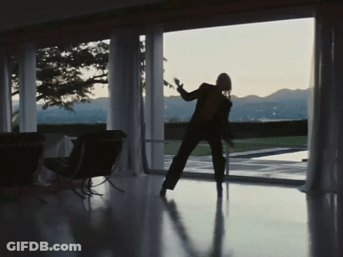 Silhouette Dancing In Front Of Large Window GIF