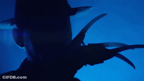 Silhouette Holding Scissors GIF