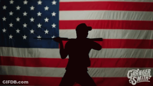 Silhouette Man Holding Gun In Front Of American Flag Granger Smith GIF