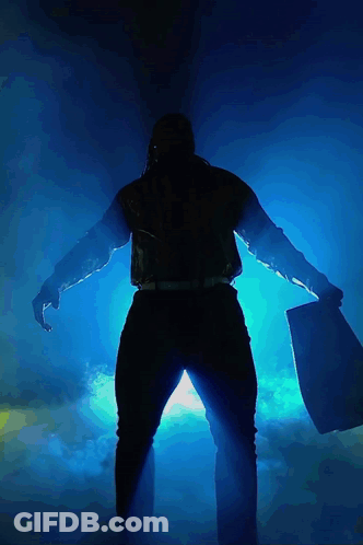 Silhouette Man Holding Large Axe GIF