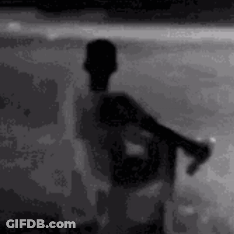 Silhouette Man On Beach Holding Soda GIF